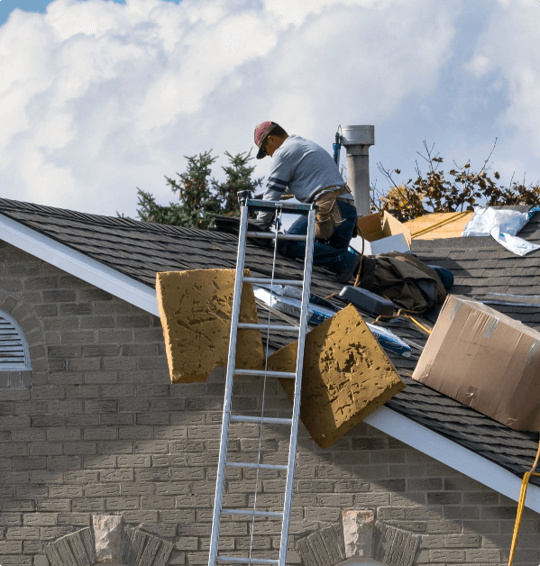 Roofer installing shingles